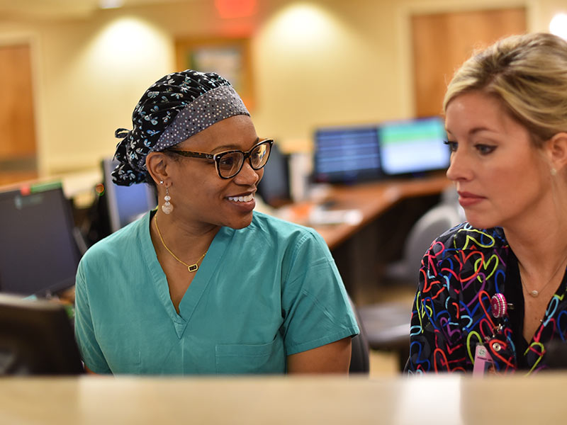 During her residency stint at Forrest General Hospital, Dr. Jaleen Sims, left, has gotten to know Heather Odom, R.N., and other members of the labor and delivery staff. (Photo by Chloe Rouse, courtesy of Marketing and Communications Department, Forrest General Hospital