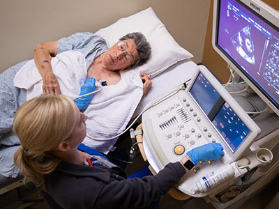 Registered diagnostic sonographer Hannah Graham administers and echocardiography to gauge how well Dudley's heart and its valves are functioning.