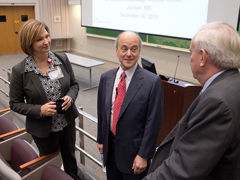 Visiting with Chassin during his 2015 visit to UMMC were Dr. Michael Henderson, UMMC chief medical officer, right, and Dr. LouAnn Woodward, vice chancellor for health affairs and dean of the School of Medicine.