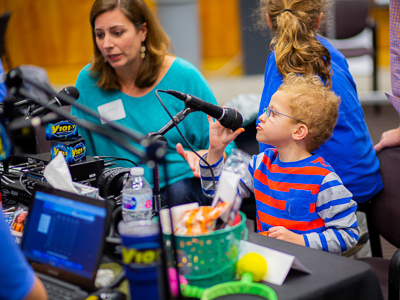 Charlie and mother Kimberly Cleland of Madison broadcast their medical story live at Mississippi Miracles Radiothon.