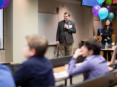 Jason Griggs, chair of the Department of Biomedical Materials Science, reads the question and possible answers aloud to students as Dr. Yuanyuan Duan, assistant professor of Biomedical Materials Science, looks on.