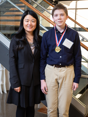 Dr. Yuanyuan Duan, associate professor in the Biomedical Materials Science department, with Joshua Bowman, Jackson's You Be the Chemist champion and 8th grader at Northwest Rankin Middle School.
