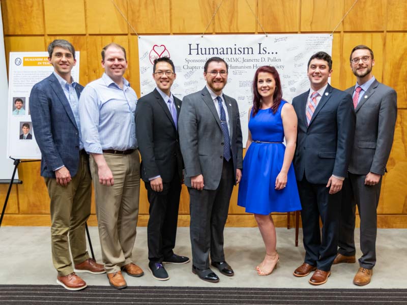 Residents honored during Tuesday's Gold Humanism Ceremony are, from left, Dr. John Rushing, Dr. Daniel Lyons, Dr. Michael Yeung-Lai-Wah, Dr. Dustyn Baker, Dr. Emily Grenn, Dr. John Caleb Grenn and Dr. Jacob Stout.