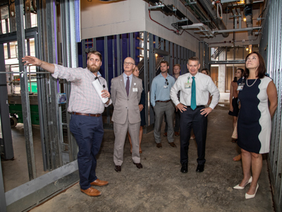 UMMC project manager Brian Reddoch, left, takes hospital leaders including, second from left, Associate Vice Chancellor for Clinical Affairs Dr. Charles O'Mara, Children's of Mississippi CEO Guy Giesecke and Dr. Mary Taylor, chair of the Department of Pediatrics.