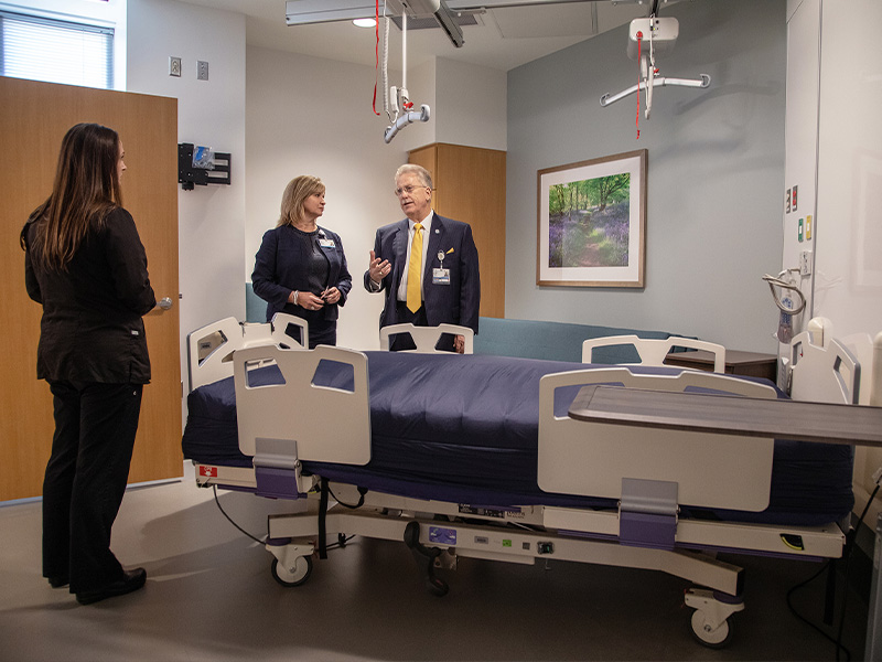 Vaughn, Woodward and Marshall visit a patient room during the dedication of the CRTU at the University of Mississippi Medical Center.