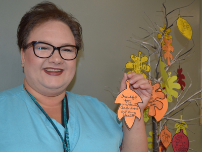 Shannon Strong, a pharmacy technician and patient advocate at the UMMC Cancer Center and Research Institute, created a small artificial tree at the center that bears leaves with gratitude messages from patients and employees.