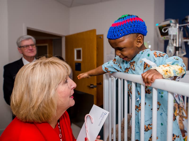 Children's of Mississippi patient Ayden Johnson of Pulaski visits with First Lady Deborah Bryant as Gov. Phil Bryant looks on.