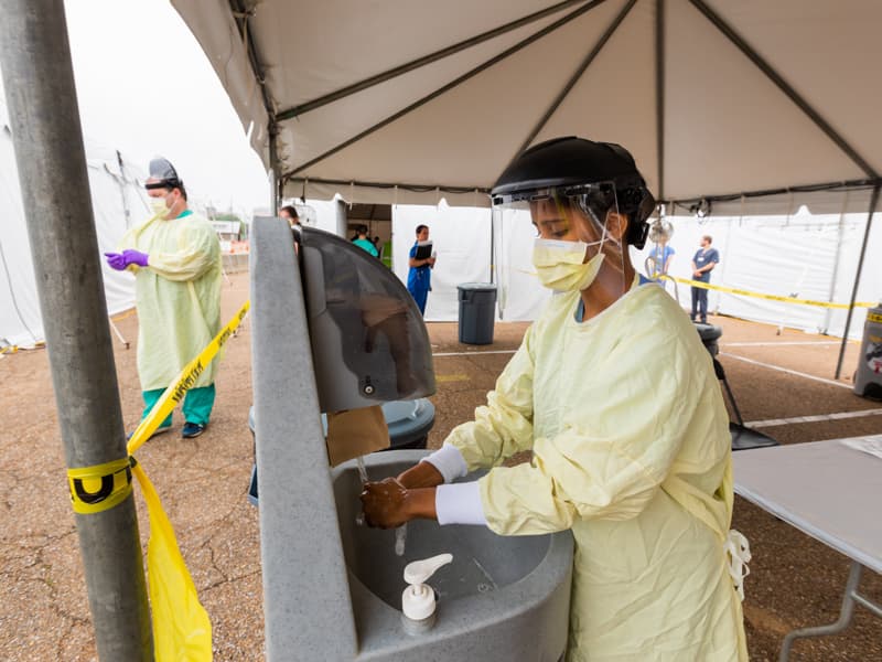 Fourth-year dental student and COVID-19 student response team leader Ambika Srivastava dons full PPE while at the fairgrounds testing site last week.