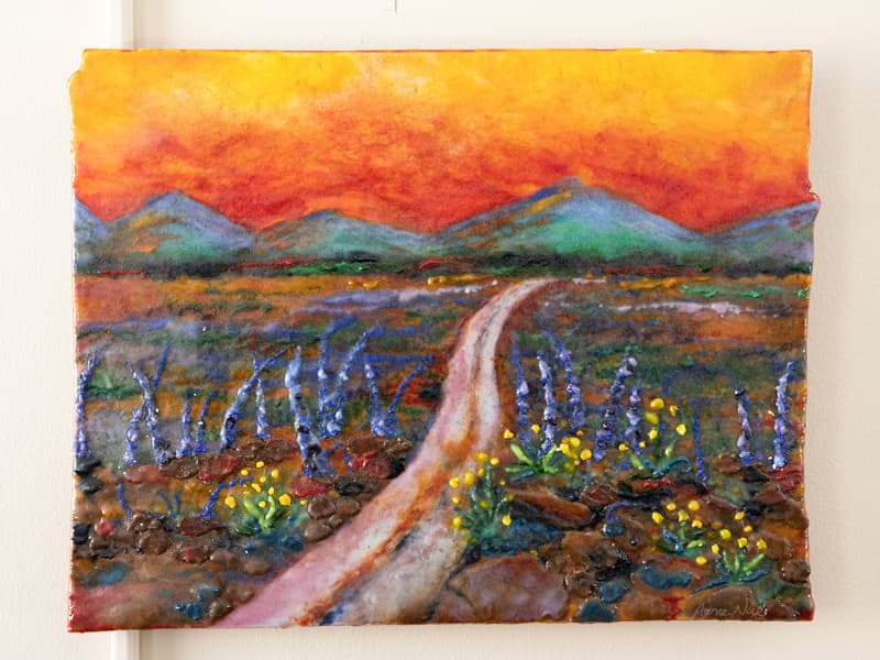Dr. Praise Matemavi's office wall is decorated with a painting she calls "The Journey," a memento from her fellowship at the University of Nebraska Medical Center.