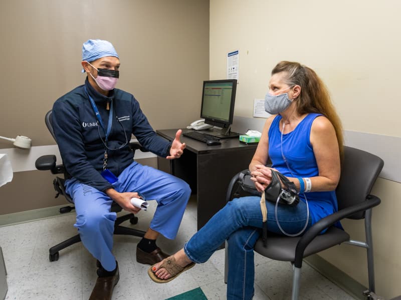 Dr. Michal Senitko discusses follow-up care with patient Tina Price for her lung volume reduction procedure.