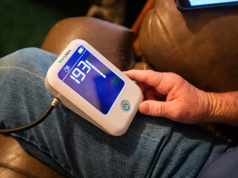 Stephen Dawkins of Vicksburg watches as his blood pressure reading falls into a more normal range. He uses a blood pressure cuff at his home, and the reading is transmitted to the Center for Telehealth via a Bluetooth-enabled tablet.