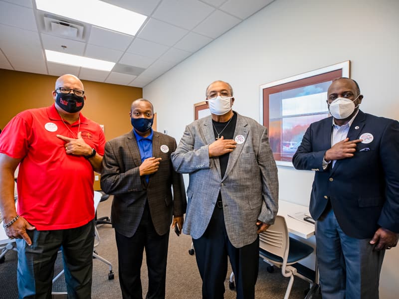 Showing off their "I got my COVID-19 vaccine" stickers, are, from left, pastors Keith Rouser, Tony Montgomery, Earnest Ward and Reginald Buckley.