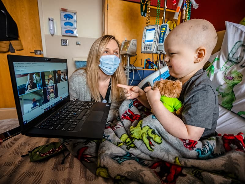 Because of the pandemic, Cash Ward of Summit couldn't come down to meet radio personalities, so they chatted online. Looking on is Tiffany Key, child life specialist.