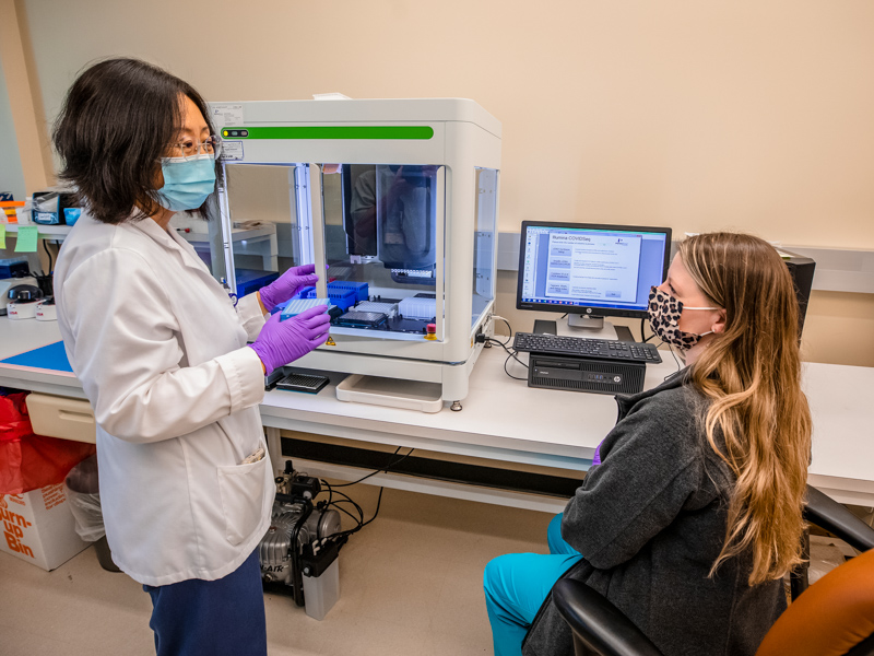 Wenjie Wu and Ashley Johnson, a researcher and a scientist in the Molecular and Genomics Core Facility, are part of the team sequencing COVID-19 variants at UMMC.