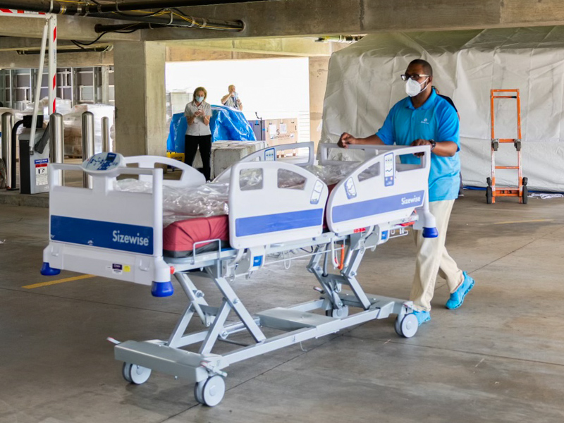 Hospital beds were moved into place in the Samaritan's Purse field hospital under construction at UMMC.