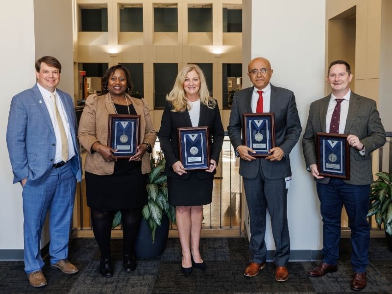 Platinum recipients include, from second left to right, Dr. Loretta Williams-Jackson, Dr. Babbette LaMarca, Dr. Saurabh Chandra and Dr. Dustin Sarver. At left is Dr. Gene Bidwell.