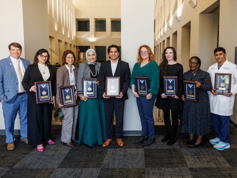 Bronze recipients include, from second left to right, Dr. Amy Kohtz, Dr. Kathleen Yee, Dr. Noha Elsayed, Dr. Utsav Nandi Dr. Candace Howard-Claudio, Dr. Brigitte Martin, Dr. Mobolaji Famuyide and Dr. Abhay Bhatt.