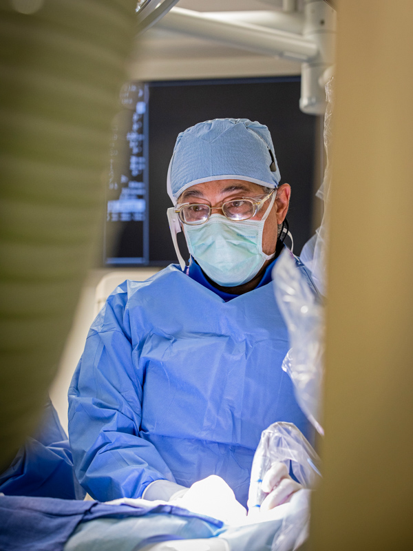 Ebeid performs a catheterization procedure.