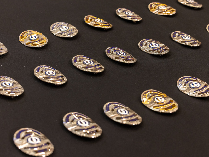 The badges belonging to the Medical Center's police and security officers were blessed Sept. 1 during a ceremony in the University Hospital chapel. Jay Ferchaud/ UMMC Communications 