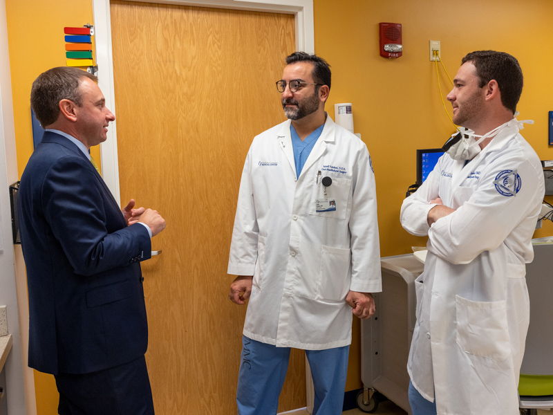 Dr. Ian Hoppe, left, consults with oral-maxillofacial surgeon Dr. Soheil Vahdani and Dr. Evan Sobiesk during a cleft team clinic day. Jay Ferchaud/ UMMC Communications 