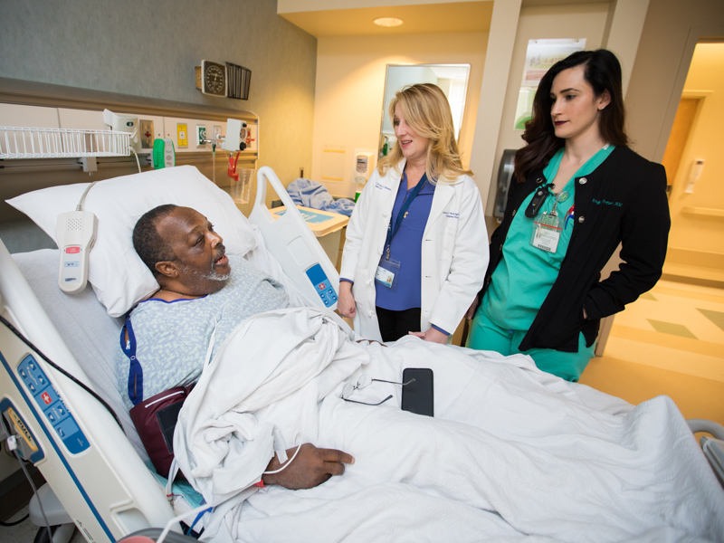 Dr. Ashley Seawright, center, and registered nurse Engaray Porter visit with 2018 transplant patient Johnny Coleman of Mobile, Ala. Joe Ellis/ UMMC Communications 