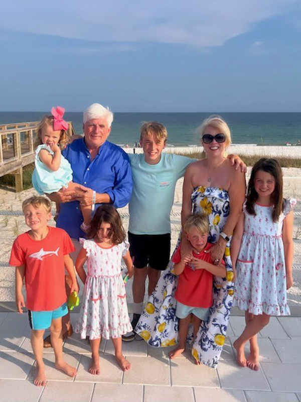 Granger and wife Linda surrounded by their six grandchildren at the beach this year.