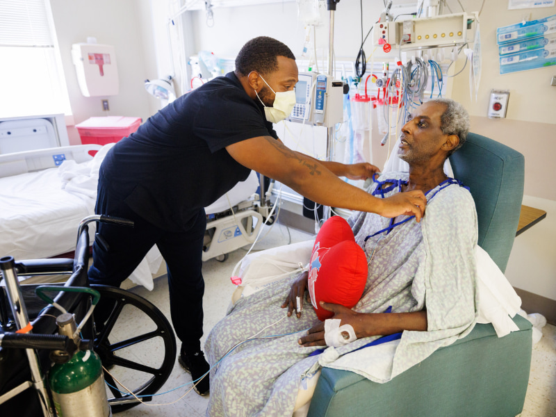Eugene Morgan, left, an exercise physiologist in cardiac rehabilitation, works with Ricky Mayers following his heart-kidney transplant. Physical Therapist Eugene Morgan with transplant patient Ricky Mayers.