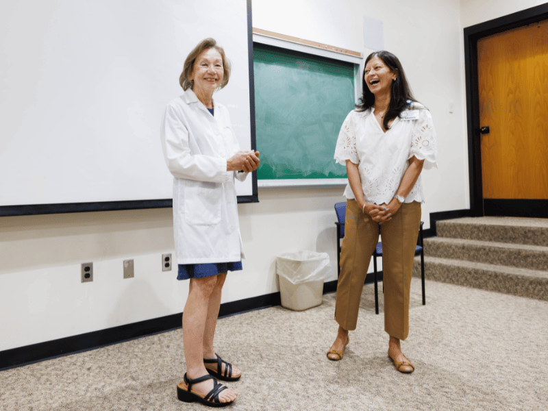 Dr. Pia Chatterjee Kirk, chair of Care Planning and Restorative Sciences, recognizes Dr. Karen Carney for 45 years of service.