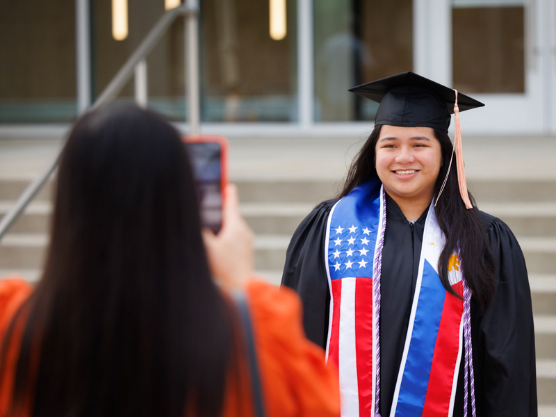 Junnah Mondejar poses for a photo before UMMC Commencement at the Mississippi Coliseum in Jackson. Mondejar graduated with a Bachelor of Science in Nursing degree. Joe Ellis/ UMMC Communications 