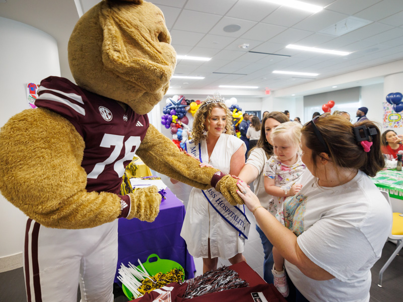 Children's of Mississippi patient Oakee Jaudon of Sidon meets Mississippi State University's mascot, Bully.