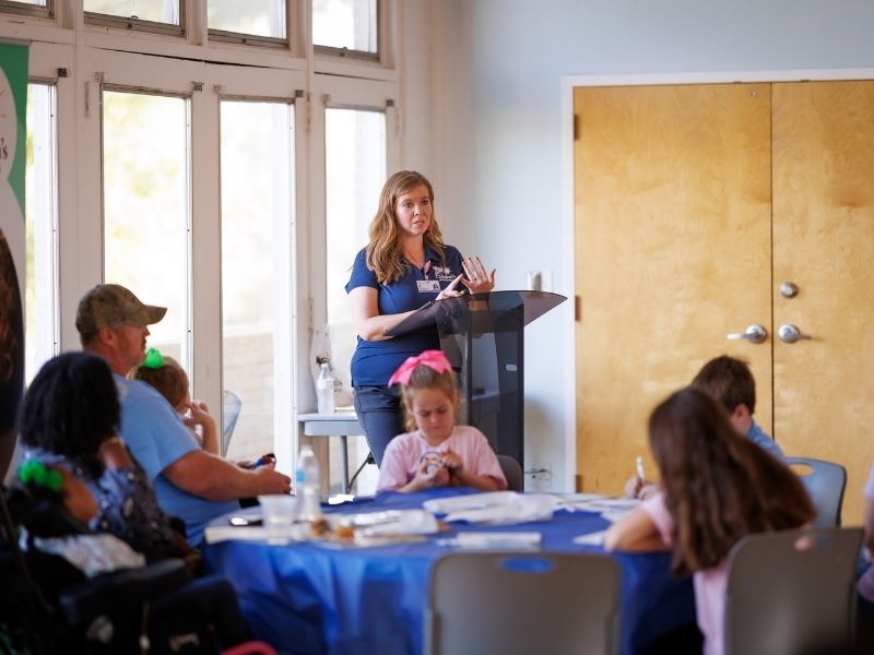 During a Saturday morning training session, Amber Magee, community development coordinator, thanks families for sharing their stories. Joe Ellis/ UMMC Communications