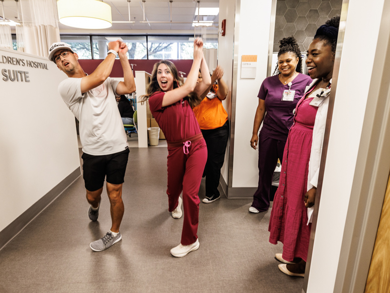 Professional golfer Philip Knowles and Dr. Laura Arnold get into the swing of Sanderson Farms Championship week at the Center for Cancer and Blood Disorders at Children's of Mississippi.