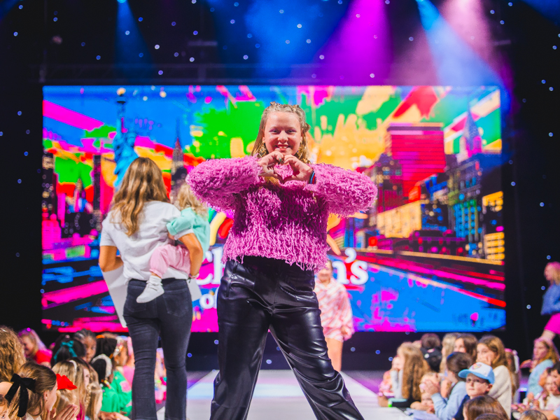 Children's of Mississippi patient Holly Ware poses on the runway during the Welcome to New York! Tween Fashion Show.