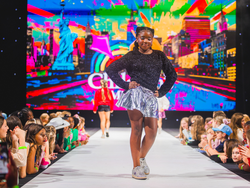 Charleigh Jones models a metallic holiday ensemble at the Welcome to New York! Tween Fashion Show.