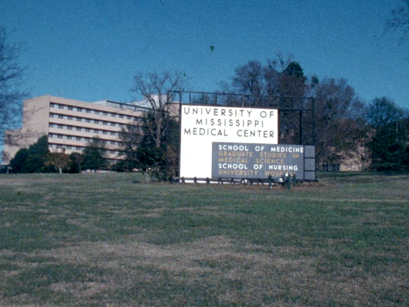 A UMMC sign from decades ago lists the schools of medicine, graduate studies in medical science and nursing, along with University Hospital.