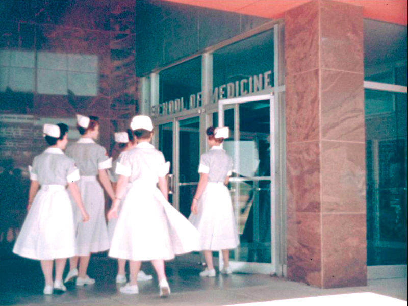 This still, taken from film shot decades ago, shows a group of nursing students at the School of Medicine entrance.