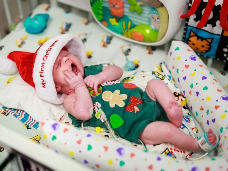 Resting before his first Christmas, Children's of Mississippi patient Levi Taunton of Flora yawns.