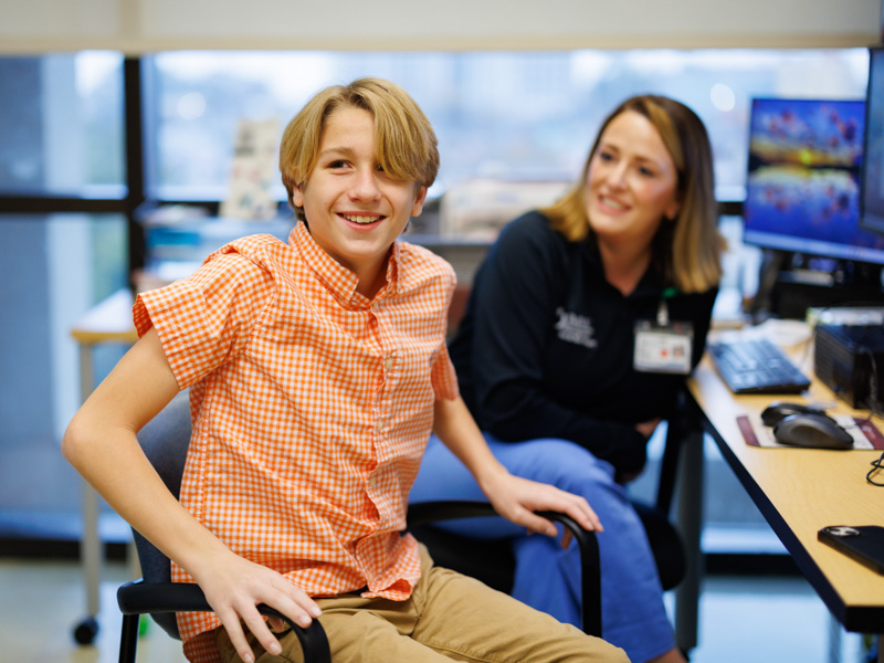 Landon Forbes smiles after Dr. Beth King activated his Sentio system, restoring hearing to one of his ears.