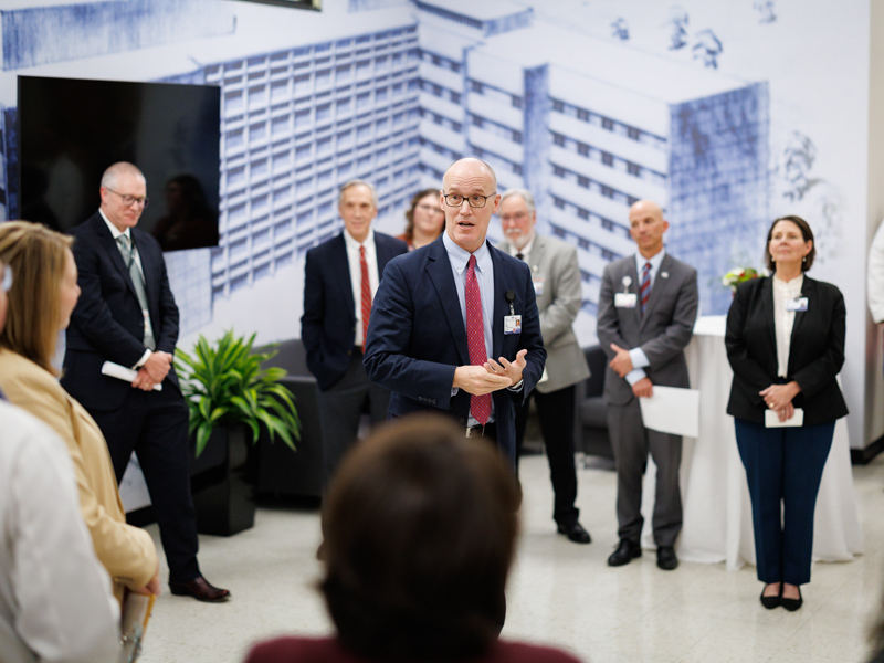 Dr. Scott Rodgers, associate vice chancellor for academic affairs, welcomes members of the Academy for Excellence in Education during a December preview of the inaugural exhibit of the Museum of Medical History.