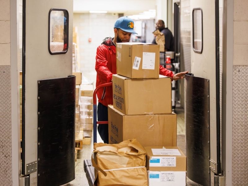 Kendric Thomas, a material management supply tech, handles a load of deliveries.