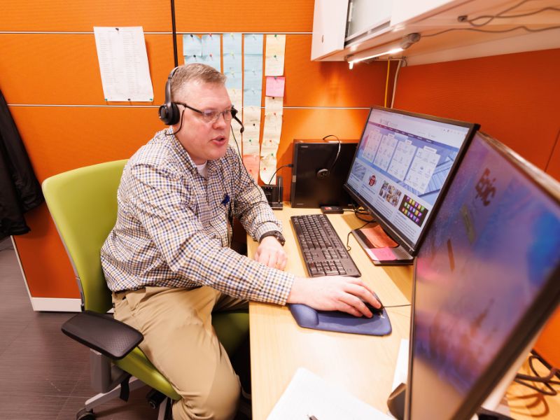 Inside the Kathy and Joe Sanderson Tower at Children's of Mississippi, physician scheduler Jeremy Moore works to connect patients and their families with care.