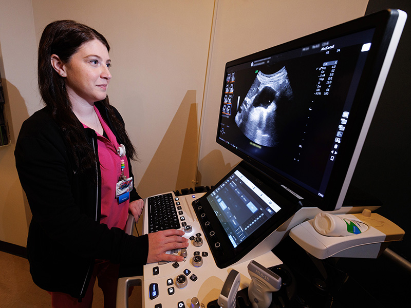 Brittani Crist, an ultrasound manager in University Hospital, examines a sonogram during her shift.