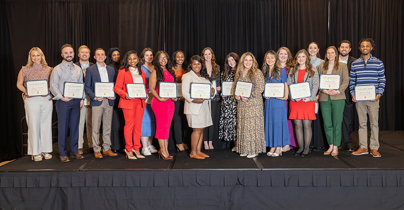 The medical students who are winners of one year cost-of-attendance scholarships display their certificates during Friday night's Rural Medicine Education Symposium. Names are listed in the accompanying article.