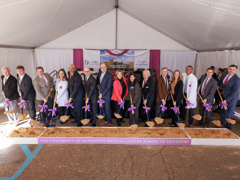 Breaking ground on the new UMMC School of Dentistry are, from left, architect Jim Eley, principal of Eley Guild Hardy Architects; Rep. Clay Deweese, Chairman House Appropriations C; Sen. Josh Harkins, Chairman Senate Finance; Malon Stratton, a fourth-year dental student; Higher Education Commissioner Dr. Alfred Rankins Jr.; Dr. Scott Rodgers, associate vice chancellor for academic affairs; Lt. Gov. Delbert Hosemann; Dr. LouAnn Woodward, vice chancellor for health affairs; Dr. Pia Chatterjee Kirk, interim dean of the School of Dentistry; Rep. John Read, Chairman House Appropriations A; Gee Ogletree, School of Dentistry alumna and previous IHL board member; Sen. Briggs Hopson, Chairman Senate Appropriations; and Secretary of State Michael Watson.