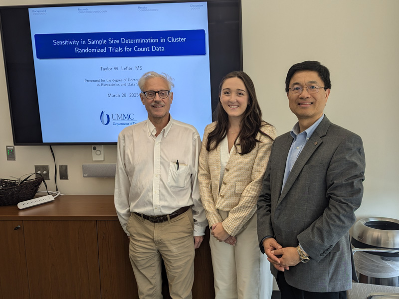 At her dissertation defense, Lefler (center), a PhD candidate graduating May 23, met with Dr. William Hillegass (dissertation co-advisor, left) and Dr. Lei Zhang (dissertation committee member, right).