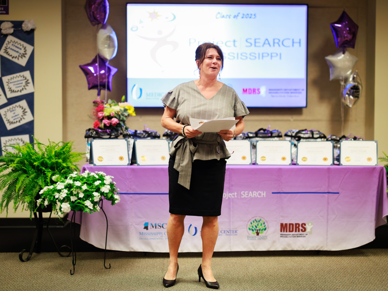 Christina Guarino, lead instructor for UMMC’s program for the Rankin County School District, gives opening remarks for the 2025 Project SEARCH graduation ceremony.