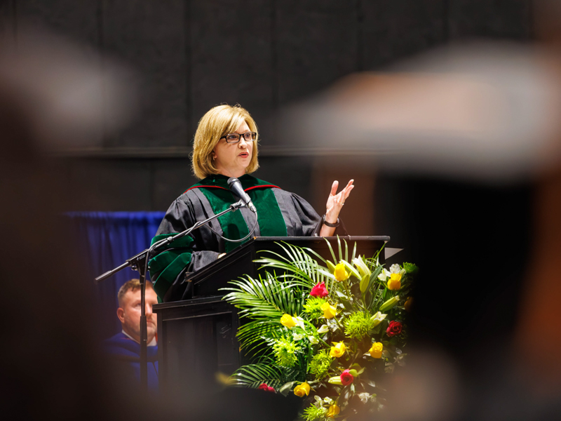 Dr. LouAnn Woodward, vice chancellor for health affairs, addresses the UMMC graduating class of 2025. Melanie Thortis/ UMMC Communications