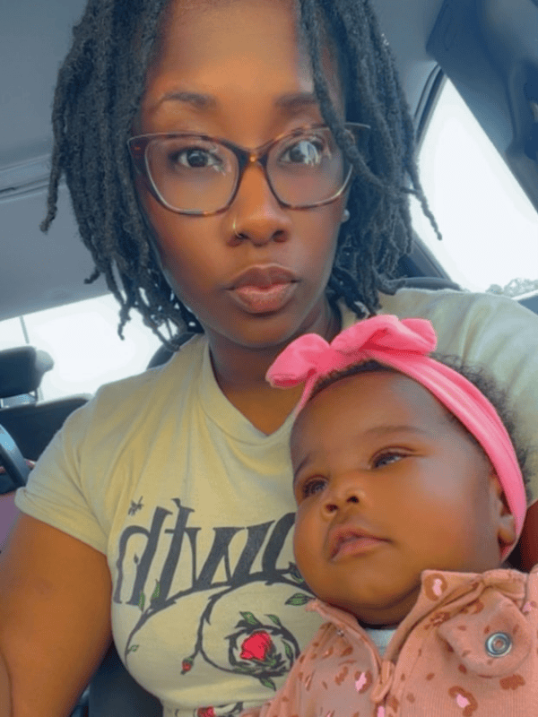 Sherika Farmer pauses for a photo with her youngest, Dreahm Straughter.