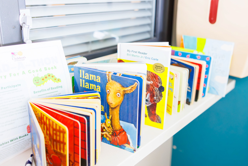 Studies have shown that reading books to infants boosts development and future language skills.