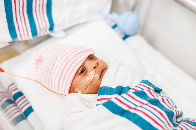 Children's of Mississippi NICU patient Sariyah Luckett of Jackson is tucked in and listening to a story.